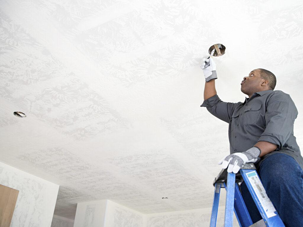 An electrician fixing wires