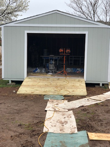 In progress -storage shed with siding installed